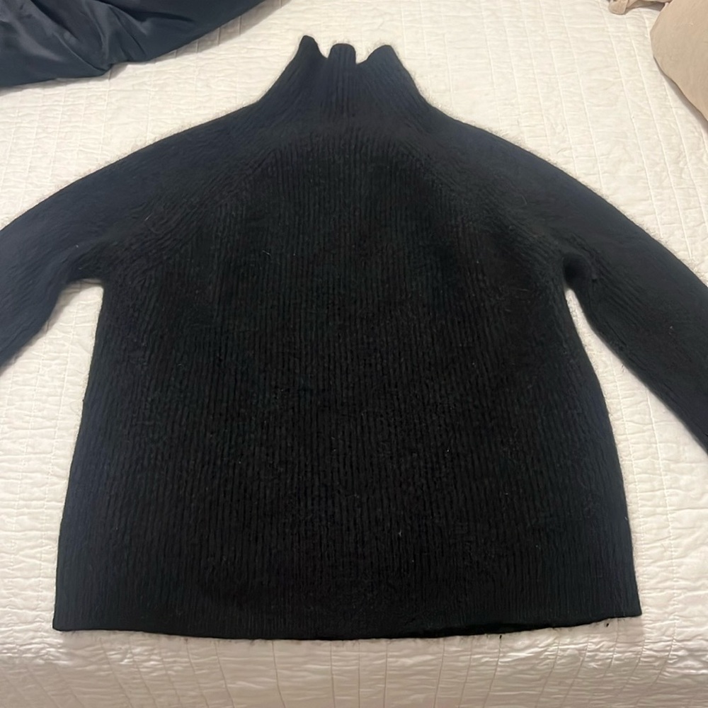 Black turtleneck, cashmere sweater. Warm and thick. Too small for me now.